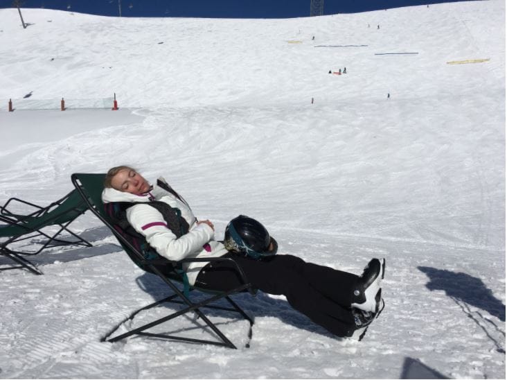 Relaxing in snow on a sunny day.